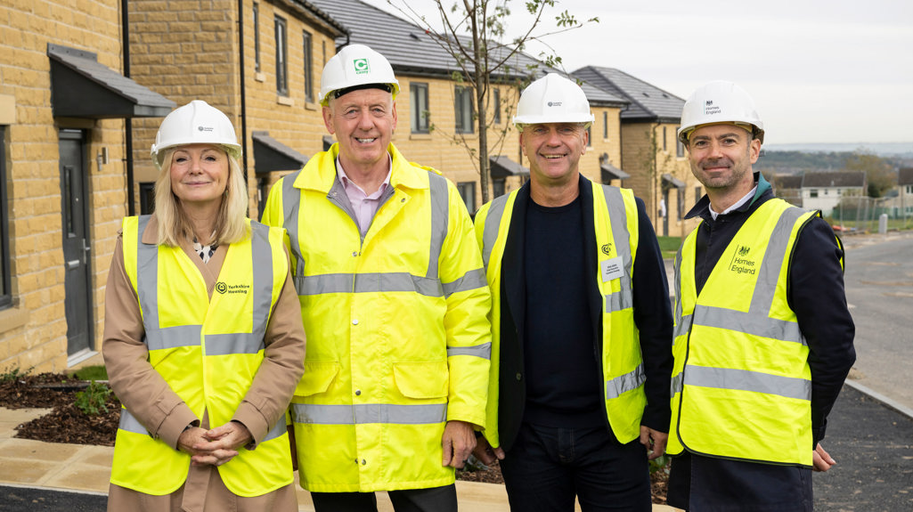 A group picture on site of Tracy Brabin with Nick Atkin, Alan and Tom. All wearing hard hats and hi vis jackets