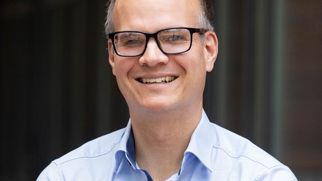 Pictured is Jan Rosenow, Director of European Programmes at the Regulatory Assistance Project, wearing a blue shirt and smiling at the camera.