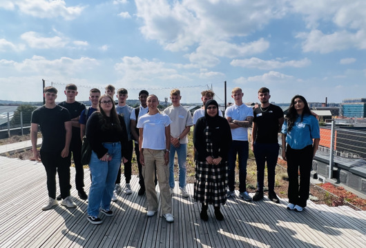 A group of apprentices on top of the roof at The Place