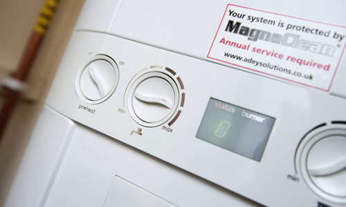 Close up of the dials on a boiler with the display showing a 0 