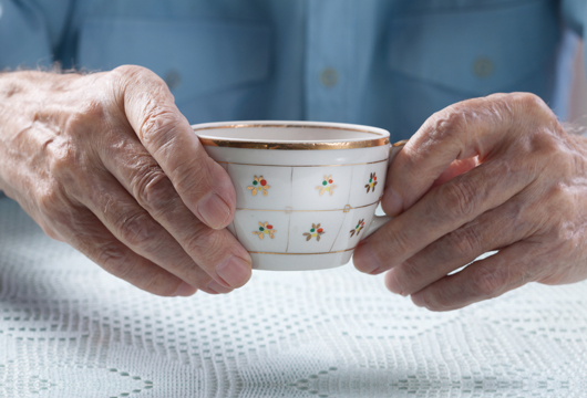 Elderly Man Holding Tea