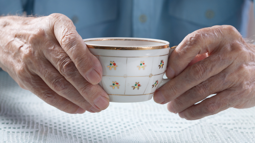 Elderly Man Holding Tea