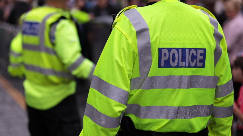 Two policemen in hi-vis coats