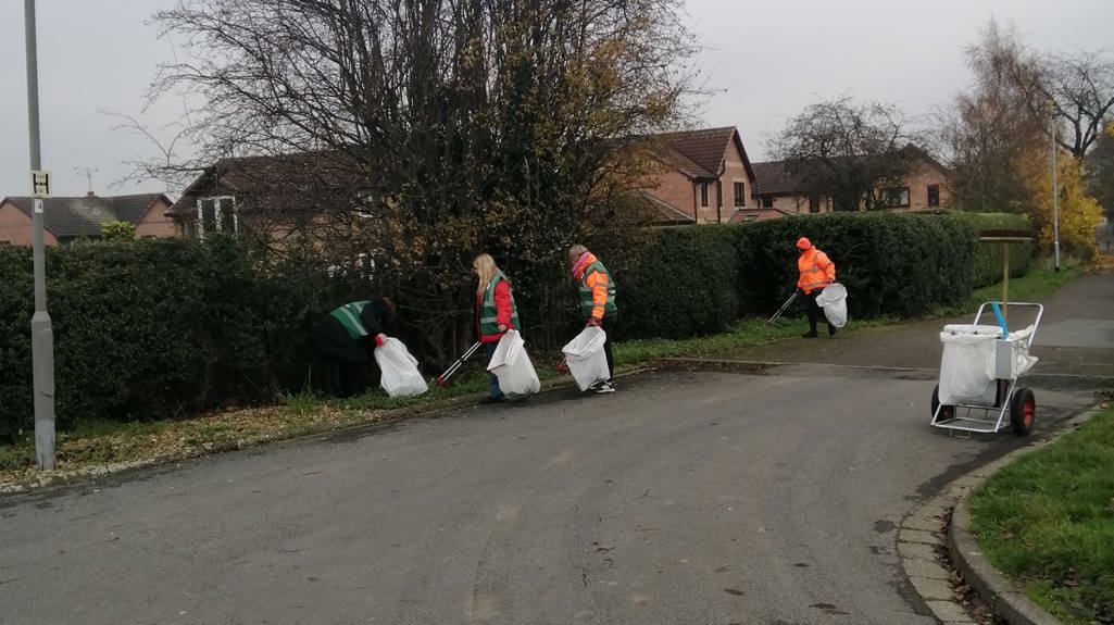 Litter pickers working in hi-vis