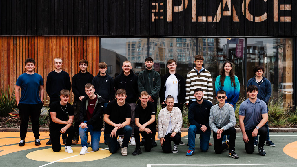 A group of colleagues, our apprentices, outside the place on their first day! 