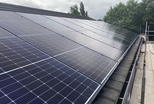 Photo shows a close up view of solar panels on a roof 